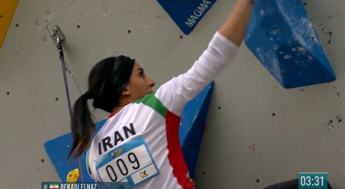Iranian athlete who defied hijab rule in Seoul competition flown back