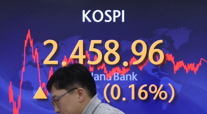 Seoul shares end tad up amid rate hike concerns