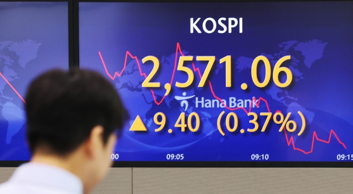 Seoul shares open slightly lower on rate hike concerns