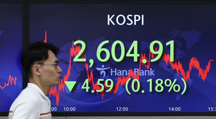 Seoul shares edge down after China's moderate rate cut