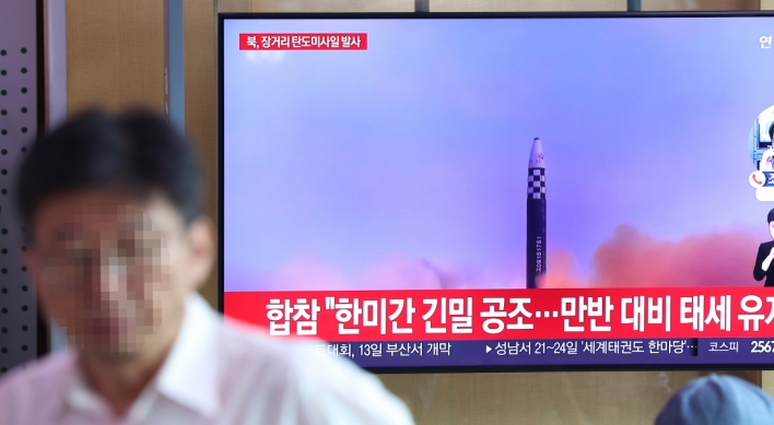 N.Korea fires two missiles as US sends nuclear submarine