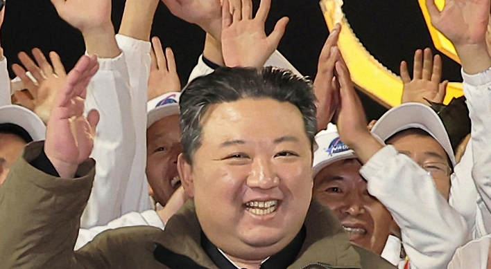 N. Korean leader lauds military spy satellite as 'space guard'