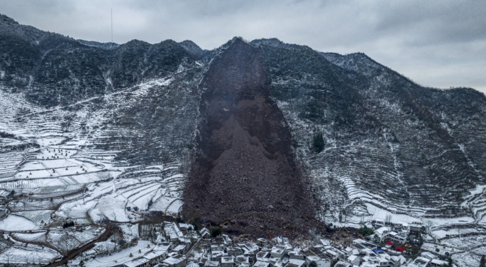 Landslide in China buries 47 people in freezing temperatures and snow
