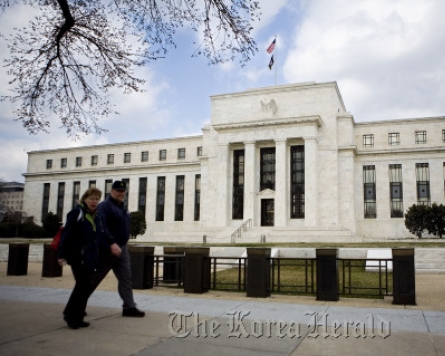 Fed officials slightly more upbeat on economy