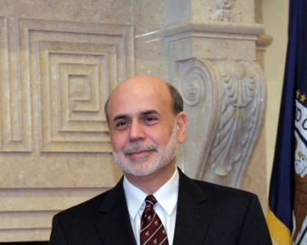 Bernanke: Fed to improve financial oversight