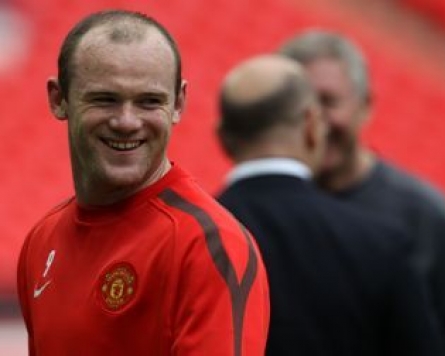 Rooney delighted with hair transplant