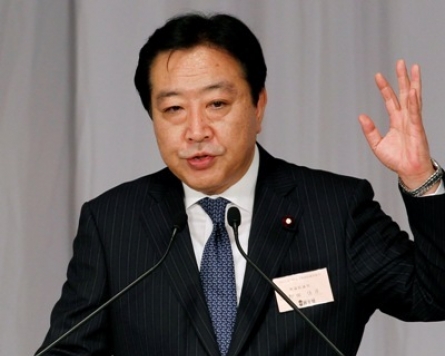 Finance minister wins Japan party vote, to be P.M.