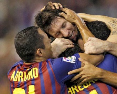 Barca rally to pull off draw at Valencia