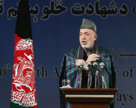Karzai condemns video of urination on corpses