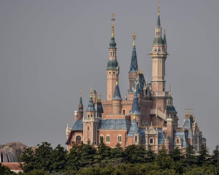 Disney closes US and Paris theme parks, delays 'Mulan' over virus