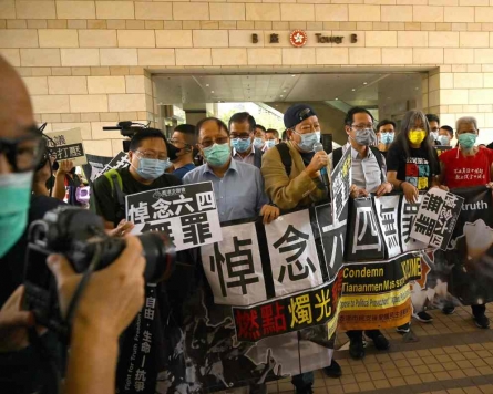 Hong Kong pro-democracy lawmakers threaten mass resignation