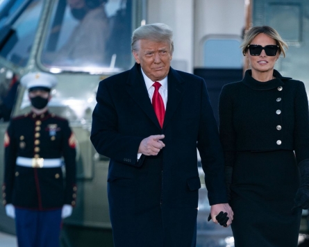Trump bids farewell to Washington, hints of comeback