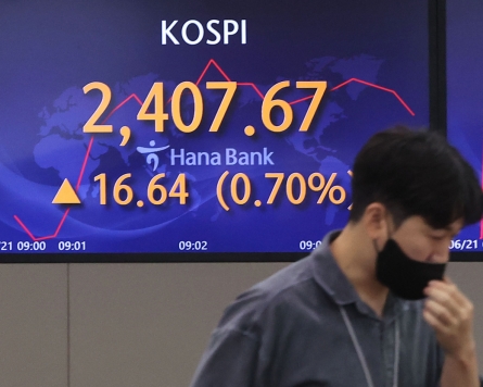 Seoul shares open slightly higher after Monday's rout