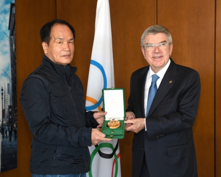 In a first for Korea, sports photographer Kim Min-jae receives Pierre de Coubertin medal