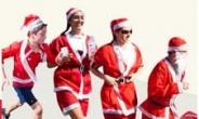 ‘한여름’ 호주, 산타 달리기 대회 “산타떼, 유쾌한 도심습격”